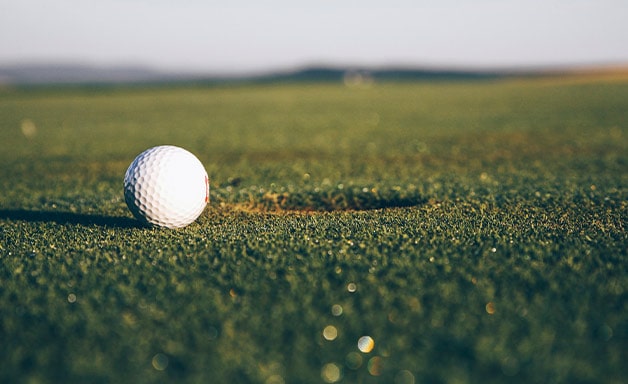 Golf ball on green grass