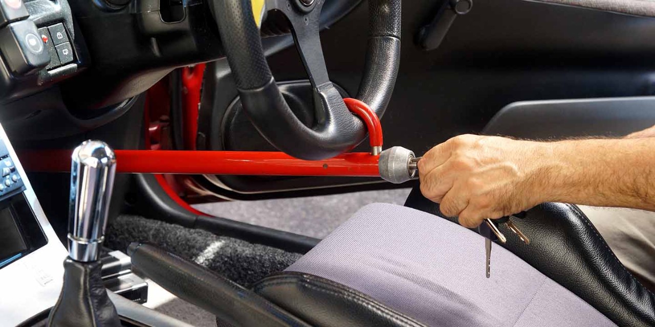 Steering wheel lock bar locked on a vehicle steering wheel 