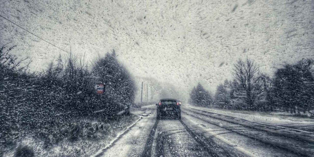 Car driving in snow