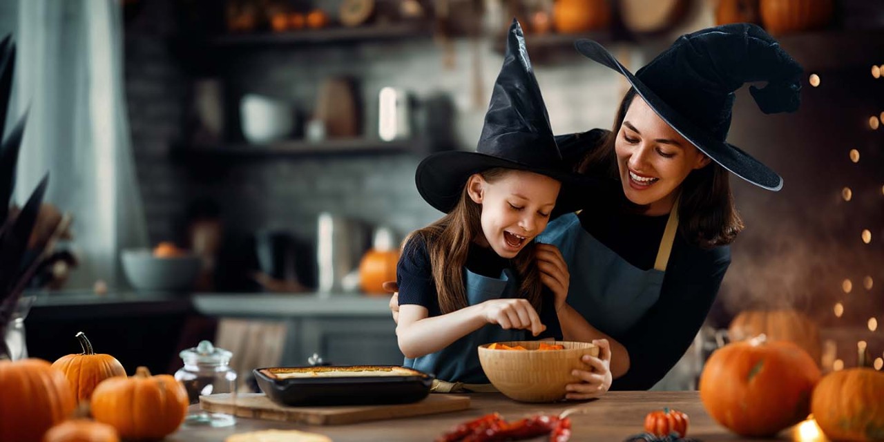 mom and daughter cooking for Halloween