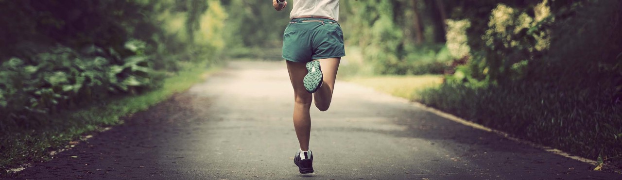 a woman running in the park