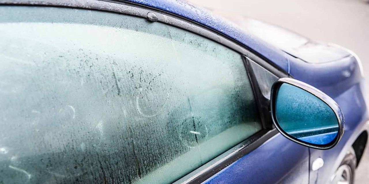 Steamy car window on a autumn rainy/foggy day
