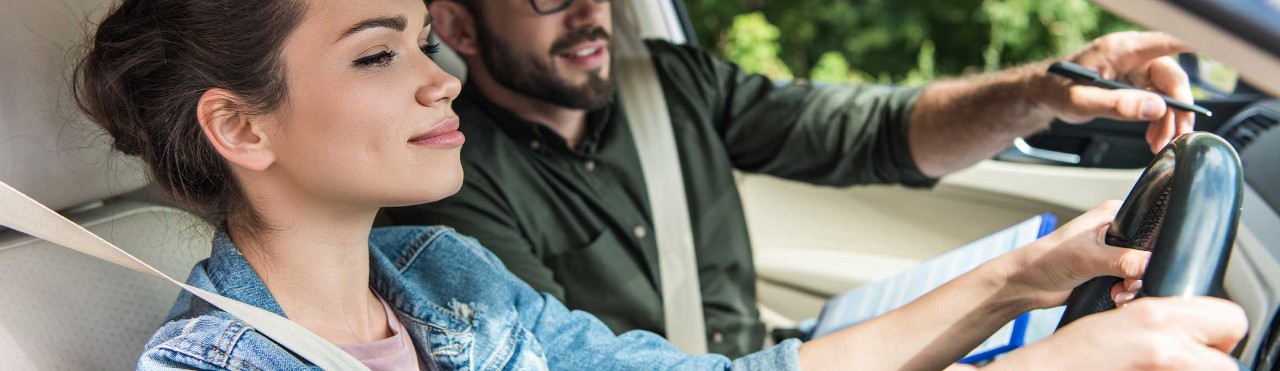 Woman driver with an instructor