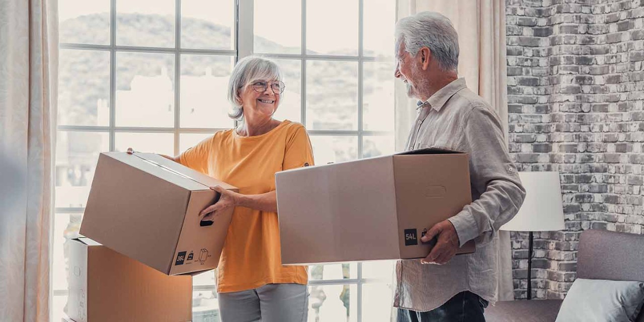  old couple with moving boxes