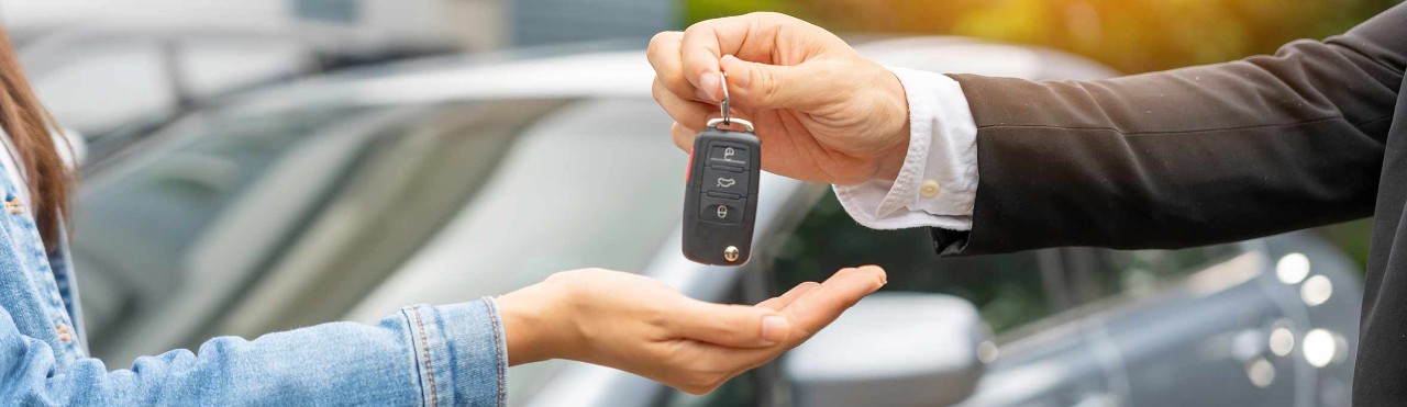 Dealership manager send car keys to the new owner