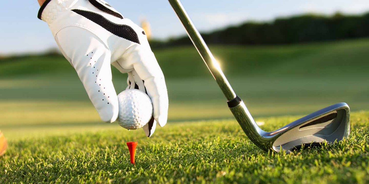  close up golf ball on green grass of golf course 