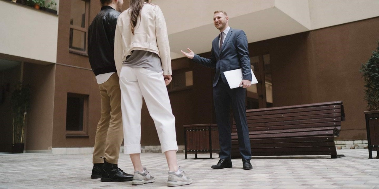  couple talking with home dealer