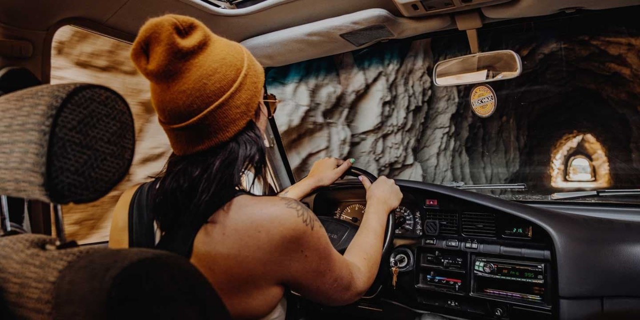 Close Up View Of Female Driver Hands On Steering Wheel
