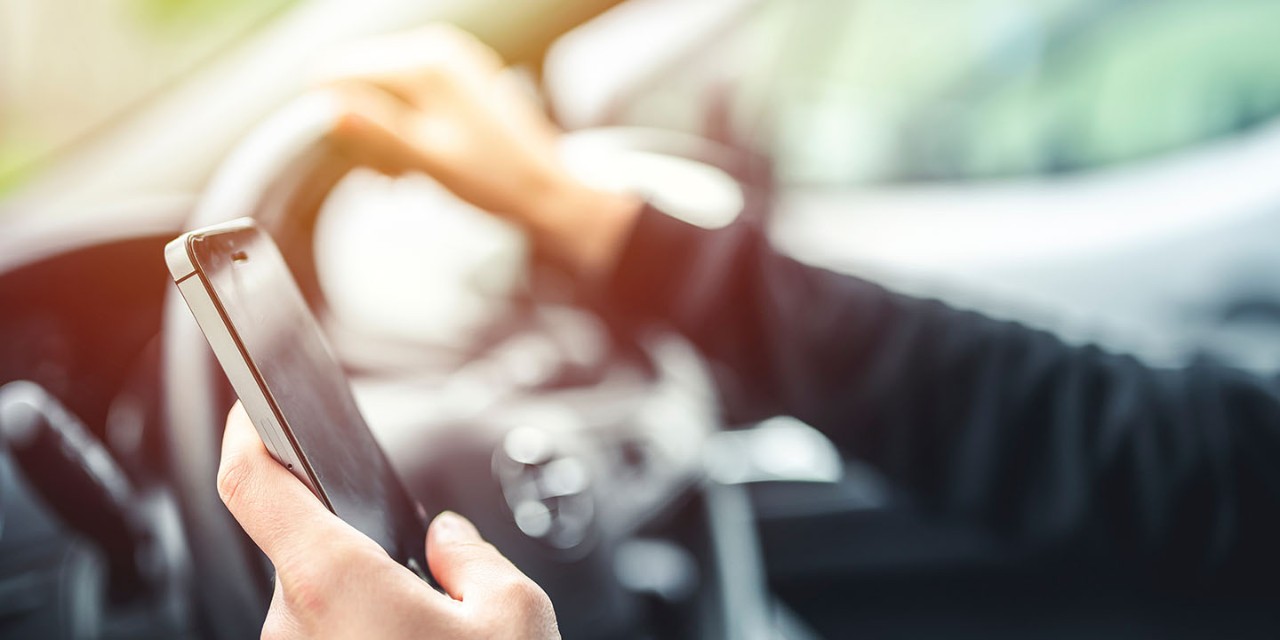 man looking at the road while driving