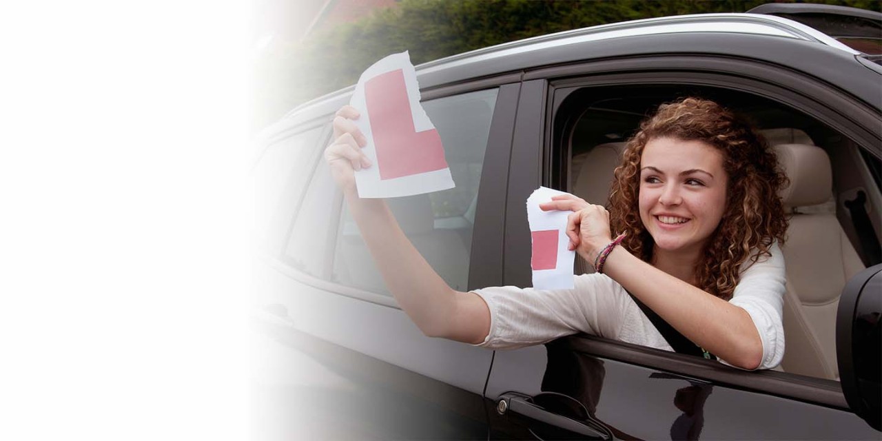  Smiling girl tearing the L plate