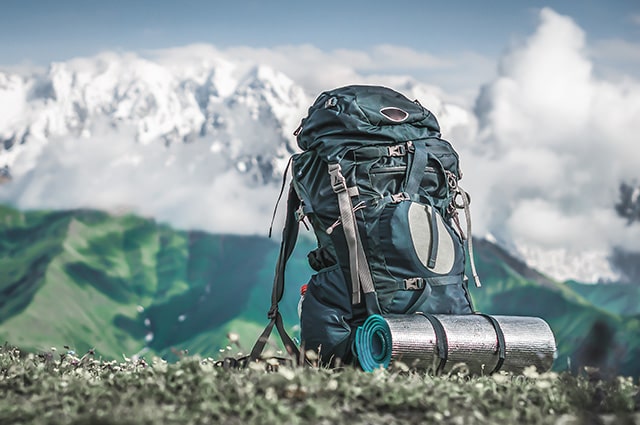 backpacking with mountain background