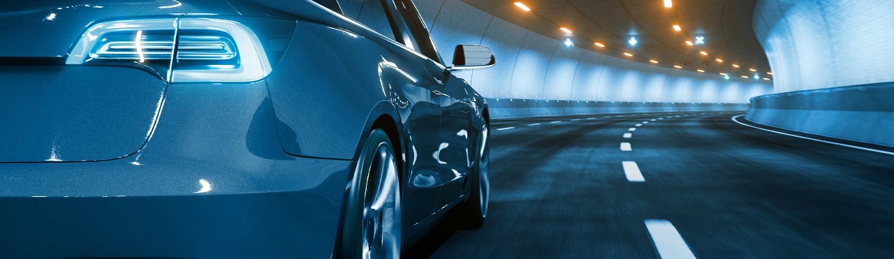 Electric car driving in a tunnel