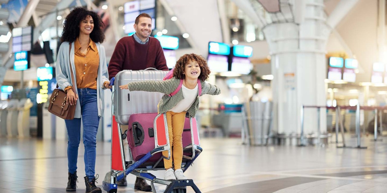 a family with suitcases in the airport