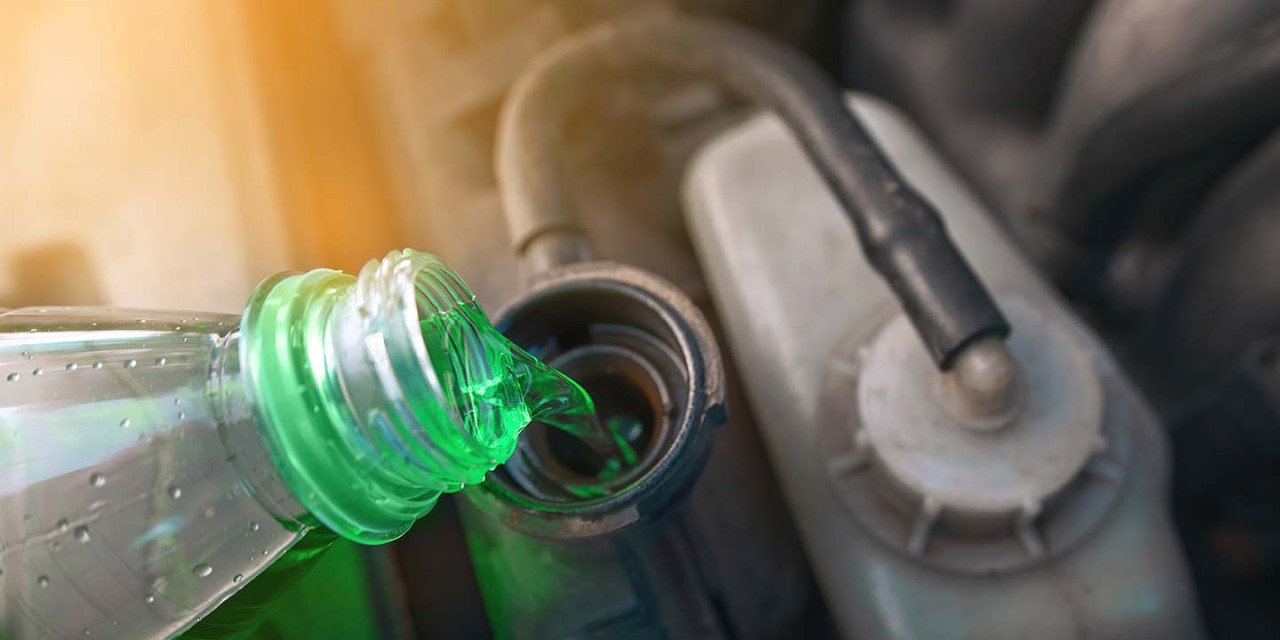 Hand filling car cooling system with coolant for cold season