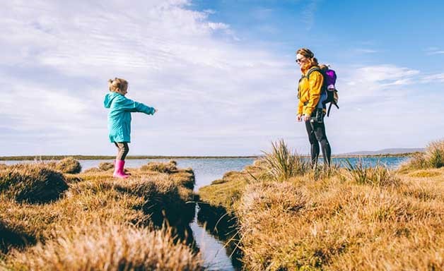 kids and woman on a trip