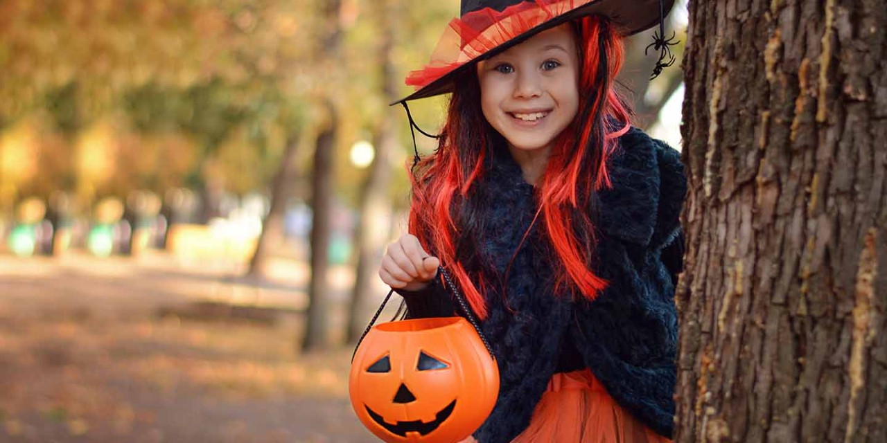 Girl with pumpkin bucket