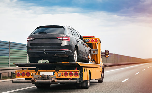 Transporting car on motorway